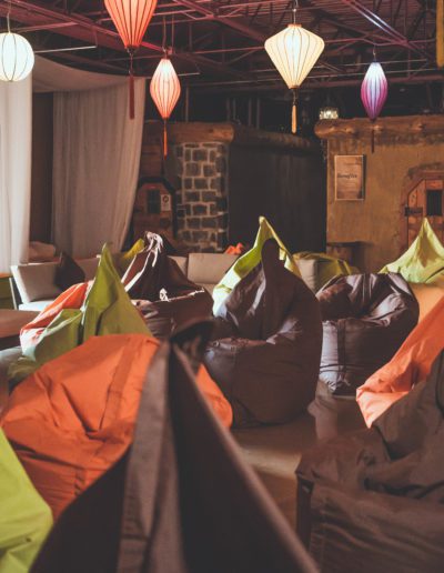 Relaxation area with paper lanterns and bean bags.