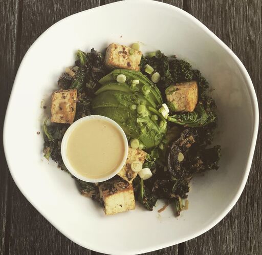 Healthy tofu salad bowl with greens.