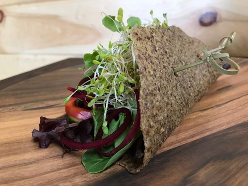 Raw vegetable sandwich with sprouts and seed bread.